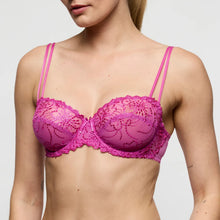 Load image into Gallery viewer, Pink lace bra worn by a model on a plain background
