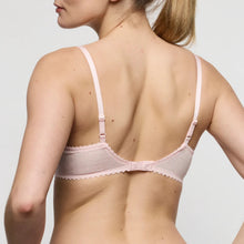 Load image into Gallery viewer, Woman wearing a light pink bra against a plain background
