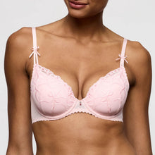 Load image into Gallery viewer, Pink bra with lace details worn by a model on a plain background
