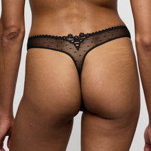 Load image into Gallery viewer, Black lace thong worn by a person on a plain background
