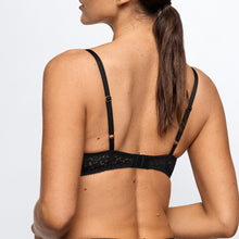 Load image into Gallery viewer, Black lace bra worn by a model on a light gray background
