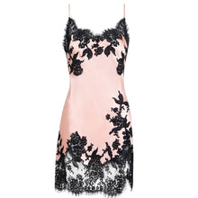 Load image into Gallery viewer, A light pink silk satin slip dress with black floral lace trim along the neckline and hem, displayed on a clean white background.
