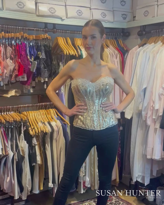 A model demonstrating the Kellie corset with gold sequent.
