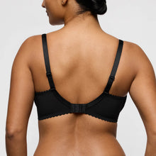 Load image into Gallery viewer, Black bra worn by a person on a light gray background
