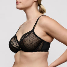 Load image into Gallery viewer, Black lace bra worn by a model on a light gray background
