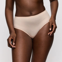 Load image into Gallery viewer, Beige high-waisted bikini bottom worn by a person on a plain background
