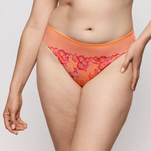 Load image into Gallery viewer, Person wearing orange lace underwear on a plain background
