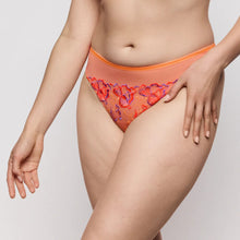 Load image into Gallery viewer, Person wearing a colorful lace-trimmed underwear on a plain background
