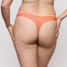 Load image into Gallery viewer, Person wearing orange underwear on a plain background
