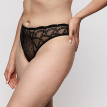 Load image into Gallery viewer, Black lace underwear worn by a person on a plain background
