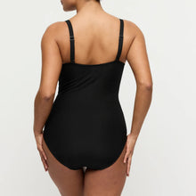 Load image into Gallery viewer, Black ribbed swimsuit worn by a model on a light gray background
