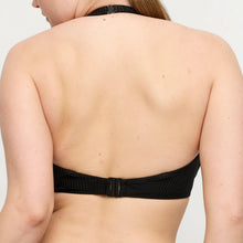 Load image into Gallery viewer, Black bikini top worn by a person on a plain background
