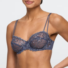 Load image into Gallery viewer, Blue lace bra worn by a model on a white background
