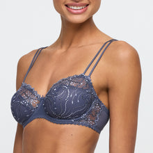 Load image into Gallery viewer, Navy blue lace bra worn by a model on a light gray background
