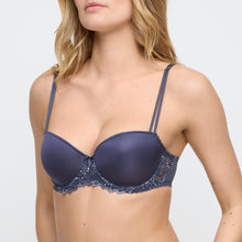 Load image into Gallery viewer, Navy blue bra with lace details worn by a model on a white background
