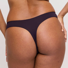 Load image into Gallery viewer, Person wearing dark purple underwear on a plain background
