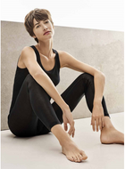 Fine knitted 100% silk singlet style vest with a satin trim on the gently rounded neckline.