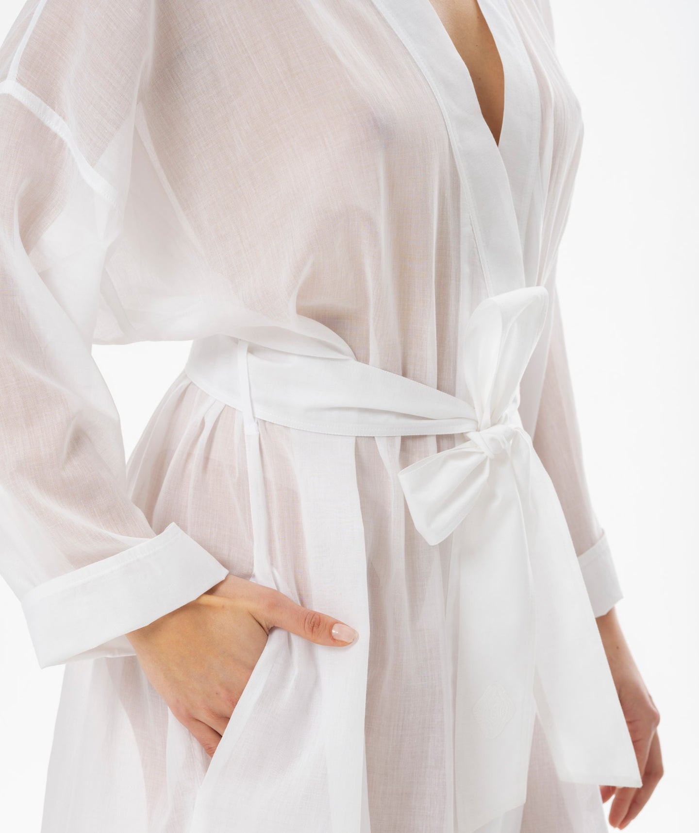 Full length (130cm) Kimono Style robe.   Made in Germany from the finest mousseline, this full length, diaphanous dressing gown is a 100% pure cotton. It has the classic Kimono style collarless style. The generous sleeves have a dropped shoulder, for that casual look. It is belted and with a side pocket. This robe offers the wearer perfect cover without heaviness.