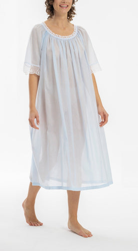 Full length (120cm) half sleeve nightgown. Gorgeous lace at the gently rounded neckline and on the short sleeve edge. Flared skirt for ease of movement when sleeping. Made in Germany from the finest pure cotton mousseline, Celestine nightdresses are diaphanous, offering perfect sleep without heaviness.