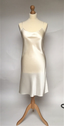 100% pure satin silk nightslip. Adjustable straps, cut on the bias for movement. Knee length.