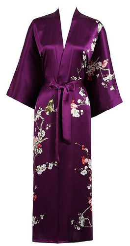 100% Pure Silk Kimono. Digitally printed with a traditional Japanese Cherry Blossom pattern. Wide sleeves, oblique pockets on each side, belted at the waist and with a hanging hook at the collar. French seams throughout.