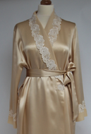 Full length dressing gown in heavy pure silk satin.The shawl collar has appliquéd lace roses on both sides. There are two side pockets and the robe is belted at the waist. 