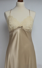 Load image into Gallery viewer, Full length pure silk satin nightgown. The bust line is composed of sheer honey lace. Full length in a heavy silk satin, there is a slit to the side for ease when sleeping. The nightdress is cut on the bias for full movement. The rouleau straps give an extra finesse to this delightful nightgown. 

