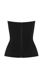 Load image into Gallery viewer, This is a beautiful corset made the French way. It has a square neckline at the front with a Twill embellishment detail around its edges. The clever hidden boning and panelling that draws in the waist and supports the bust. The matt black continues around the back. where there is a centred zip. This is a stunning garment. It is perfect for day and evening wear
