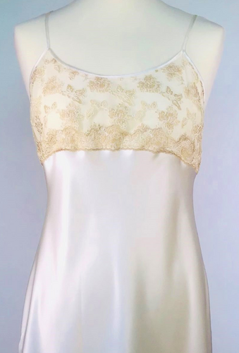 Full length pure Silk nightgown. It has a delicate embroided bodice (lined at the back for full coverage) in a ecru lace. Full length in a heavy silk satin, there is a slit to the side for ease when sleeping. 
