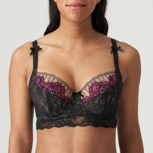 Bustier style underwire bra in black lace with complementary fuchsia pink embroidery. The balconnet tulip cut offers excellent support, especially to the larger cup size. This retro style bra with roses and tulle back is the perfect piece for this winter's wardrobe. Bow details on the straps complete the contemporary yet timeless look.