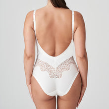 Load image into Gallery viewer, This body suit has a wonderful plunging back. The embroidery under the bust and around the back sculpts the body beautifully.  The cups are completely smooth. An extra band is provided for extra bust support if needed. The feminine, natural colour is perfect under light-coloured outfits.   Fabric content: Polyamide: 62%, Polyester: 21%, Elastane:16%, Cotton:1%

