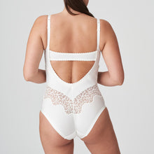 Load image into Gallery viewer, This body suit has a wonderful plunging back. The embroidery under the bust and around the back sculpts the body beautifully.  The cups are completely smooth. An extra band is provided for extra bust support if needed. The feminine, natural colour is perfect under light-coloured outfits.   Fabric content: Polyamide: 62%, Polyester: 21%, Elastane:16%, Cotton:1%
