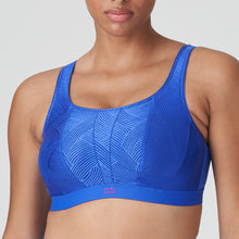 Load image into Gallery viewer, Electric Blue fantastically supportive non-wire bra. It offers versatile support and extreme comfort. Adjustable straps, with hooks and eyes. The delicate printed cups and straps have a cross-back or straight option. Three-part cup for extra support. Padded straps and closure. No irritation seamless cup. Anti-chafing super soft elastic banding.   The performance fabric uses highly breathable technology to keep you cool, fresh and dry. Fabric Content: Polyamide: 45%, Polyester: 42%, Elastane:13%
