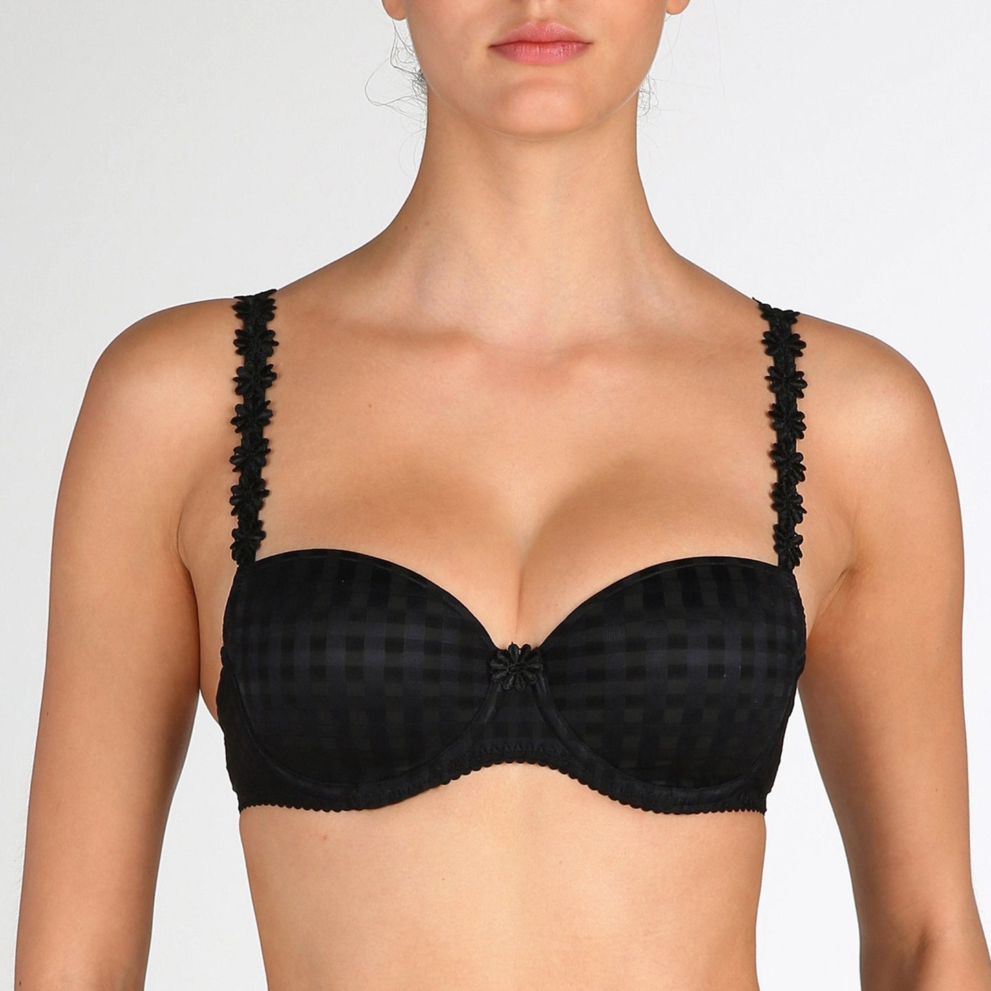 Smooth formed cup underwire balconnet bra with daisy strap detail. This underwire bra may be converted to a halter strap. This bra has the added advantage that it may be used as a halter or crossed over at the back.  Fabric Content: Polyester: 53%, Polyamide: 39%, Elastane: 8%