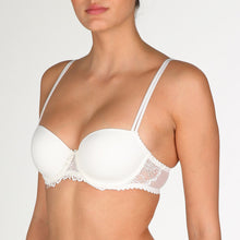 Load image into Gallery viewer, Jane formed and seamless cupped bra with the seductive balconnet neckline. Smooth opaque cups with floral lace trim. The wider wire ensures optimal comfort. Lifts the bust, creating a natural image. Perfect for multiple necklines. B to F cup. Fabric content: Polyamide: 66%, Polyester: 26%, Elastane: 8%. Ivory.
