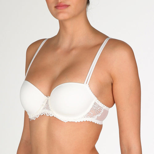 Jane formed and seamless cupped bra with the seductive balconnet neckline. Smooth opaque cups with floral lace trim. The wider wire ensures optimal comfort. Lifts the bust, creating a natural image. Perfect for multiple necklines. B to F cup. Fabric content: Polyamide: 66%, Polyester: 26%, Elastane: 8%. Ivory.